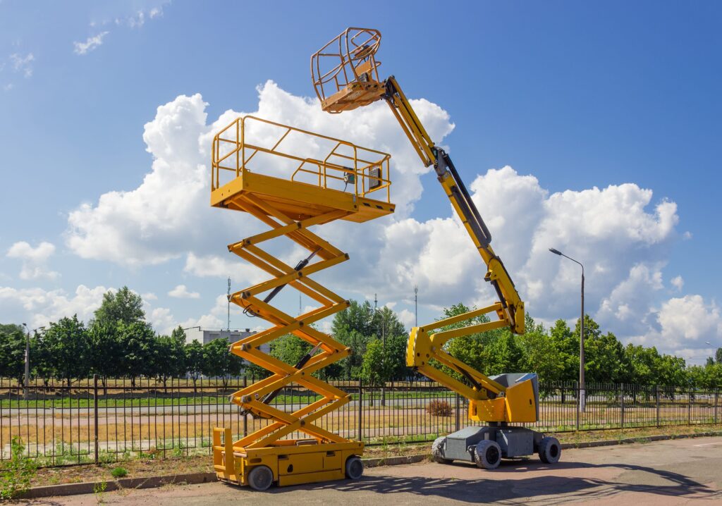 scissor lift and boom lift side by side